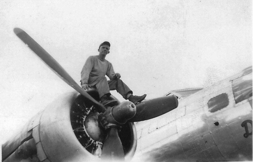 Unknown Ground Crewmember Sitting on B-17 Engine - 601st Squadron - 1944